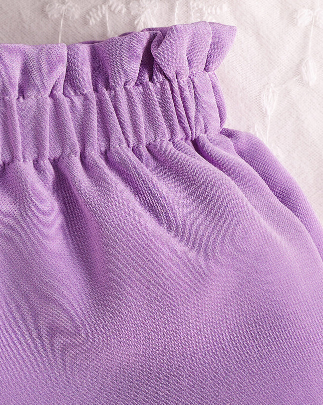Lavender ruffled elastic waistband detail on children's shorts, gathered fabric, summery style