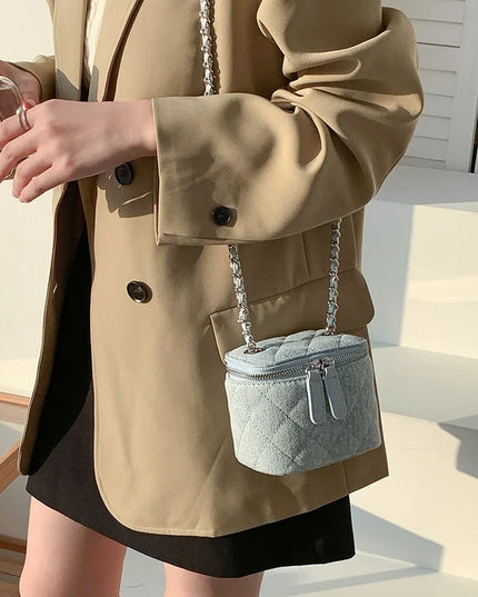 Light blue quilted denim mini crossbody bag with chain strap