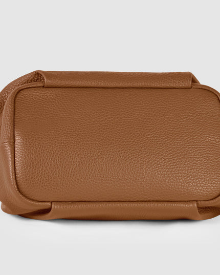 Bottom view of a brown pebbled calfskin leather top-handle bag from Italy, Pretty Melanin Boutique