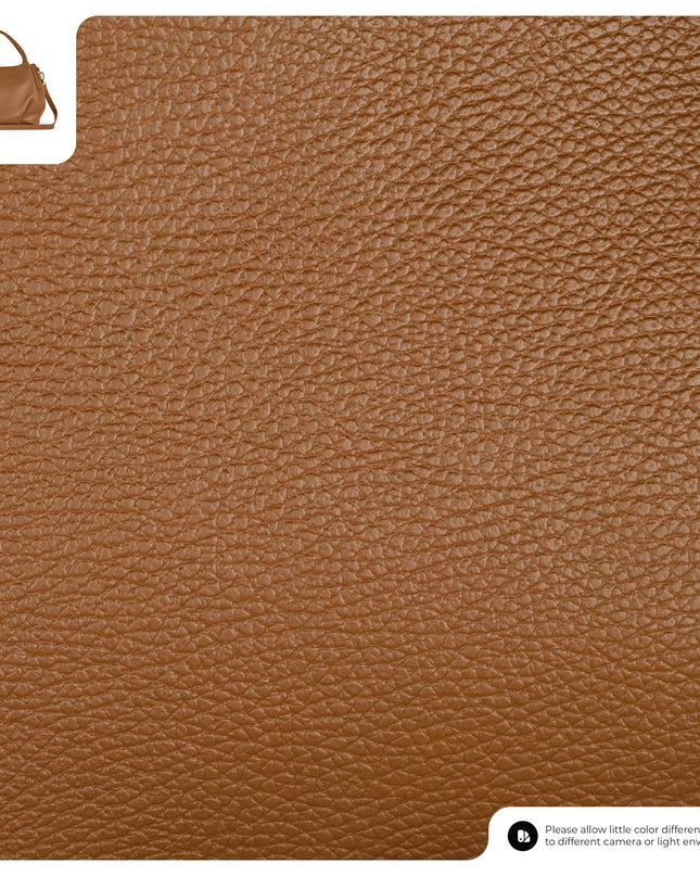 Brown pebbled Italian calfskin leather handbag with top handles and adjustable strap.